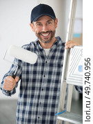 male painter and decorator with a stepladder and roller. Стоковое фото, агентство Ingram Publishing / Фотобанк Лори
