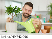 takin care of a bonsai. Стоковое фото, агентство Ingram Publishing / Фотобанк Лори