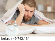 monday morning again - man unhappy to wake up. Стоковое фото, агентство Ingram Publishing / Фотобанк Лори