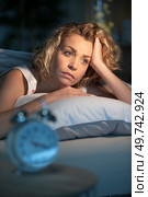 woman cannot fall asleep late at night. Стоковое фото, агентство Ingram Publishing / Фотобанк Лори