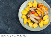 Appetizing slice meat roasted with tropical pineapple. Copy space. Exotically meat roasted with pineapple. Стоковое фото, агентство Ingram Publishing / Фотобанк Лори