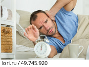 man suffering from bad case of insomnia. Стоковое фото, агентство Ingram Publishing / Фотобанк Лори