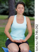 young fit athletic woman in a forest doing yoga. Стоковое фото, агентство Ingram Publishing / Фотобанк Лори