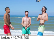 portrait of boys playing beach volleyball. Стоковое фото, агентство Ingram Publishing / Фотобанк Лори