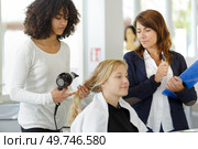 two women are drying hair. Стоковое фото, агентство Ingram Publishing / Фотобанк Лори