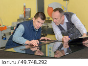 workers in coverall with different glasses. Стоковое фото, агентство Ingram Publishing / Фотобанк Лори