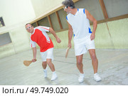 team of men playing pala. Стоковое фото, агентство Ingram Publishing / Фотобанк Лори