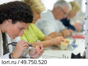 technician using precision drill on prosthetic teeth. Стоковое фото, агентство Ingram Publishing / Фотобанк Лори