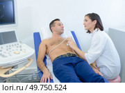 she is doing chest ultrasound. Стоковое фото, агентство Ingram Publishing / Фотобанк Лори