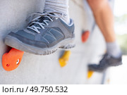 rock climber moving up on a rocky artificial wall. Стоковое фото, агентство Ingram Publishing / Фотобанк Лори