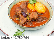 Appetizing goulash made from venison meat, meat goulash or soup with potatoes in a bowl.. Venison goulash, deer ragout. Стоковое фото, агентство Ingram Publishing / Фотобанк Лори