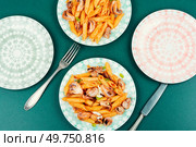 Tasty macaroni or pasta cooked with octopus. Greek food recipe. Italian restaurant food.. Seafood pasta with octopus. Стоковое фото, агентство Ingram Publishing / Фотобанк Лори