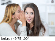 gossip girl tells a secret to her friend. Стоковое фото, агентство Ingram Publishing / Фотобанк Лори