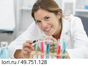 happy woman scientist with pipettes in lab. Стоковое фото, агентство Ingram Publishing / Фотобанк Лори