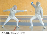 portrait of a couple and fencing competition. Стоковое фото, агентство Ingram Publishing / Фотобанк Лори