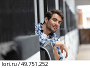 portrait of handsome man standing in stables. Стоковое фото, агентство Ingram Publishing / Фотобанк Лори