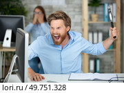 entrepreneur angry and furious with computer. Стоковое фото, агентство Ingram Publishing / Фотобанк Лори