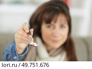 a woman eating pills tablets. Стоковое фото, агентство Ingram Publishing / Фотобанк Лори