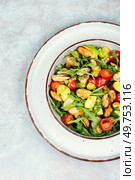 Salad with mussels and arugula on a glass plate. Top view. Delicious seafood mussels salad. Стоковое фото, агентство Ingram Publishing / Фотобанк Лори