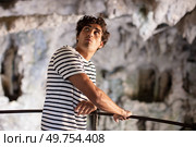 beautiful man in a mountain cave. Стоковое фото, агентство Ingram Publishing / Фотобанк Лори