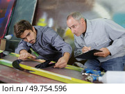 constructor specialist projecting new engine. Стоковое фото, агентство Ingram Publishing / Фотобанк Лори