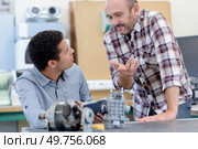 young future mechanical engineer studying a part. Стоковое фото, агентство Ingram Publishing / Фотобанк Лори