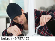 woman adjusting lever on a metal chair. Стоковое фото, агентство Ingram Publishing / Фотобанк Лори