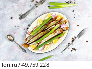 Plate with delicious smoked capelin. Smoked capelin fish with lemon. Стоковое фото, агентство Ingram Publishing / Фотобанк Лори
