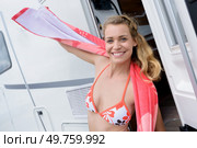 beautiful young surfer girl having fun on campervan holiday. Стоковое фото, агентство Ingram Publishing / Фотобанк Лори
