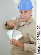 painter trying to match colours for painting job. Стоковое фото, агентство Ingram Publishing / Фотобанк Лори
