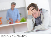 young man is under exam pressure. Стоковое фото, агентство Ingram Publishing / Фотобанк Лори