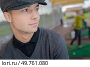 a confident young male golfer. Стоковое фото, агентство Ingram Publishing / Фотобанк Лори