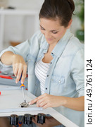 woman and close up of furniture fittings. Стоковое фото, агентство Ingram Publishing / Фотобанк Лори