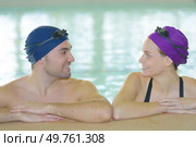 young couple of swimmers inside swimming pool. Стоковое фото, агентство Ingram Publishing / Фотобанк Лори