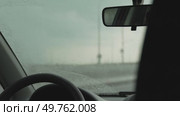 Windshield wipers rain: Driving inside vehicle during rainy day, wipers are operating for better visibility. Стоковое видео, видеограф svetograph / Фотобанк Лори