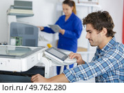 a multi-function office appliance technician. Стоковое фото, агентство Ingram Publishing / Фотобанк Лори