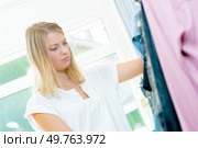 a woman does not know what to wear. Стоковое фото, агентство Ingram Publishing / Фотобанк Лори