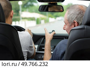 young man and father driving together in a new car. Стоковое фото, агентство Ingram Publishing / Фотобанк Лори