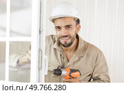 portrait of handsome attractive repairer in protective hard ha. Стоковое фото, агентство Ingram Publishing / Фотобанк Лори