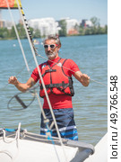 professional waterman training on lake with catamaran. Стоковое фото, агентство Ingram Publishing / Фотобанк Лори