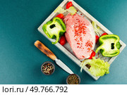 Spices on sliced raw pork meat, assorted raw meats for barbecuing. Space for text.. A photo of raw pork on the table. Стоковое фото, агентство Ingram Publishing / Фотобанк Лори