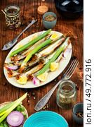 Cold smoked capelin fish. Salty snacks. Omega3.. Smoked capelin fish with lemon. Стоковое фото, агентство Ingram Publishing / Фотобанк Лори