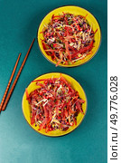 Bowl with healthy vegetarian bowl dish with fresh flaxseed sprouts and black carrots.. Healthy salad with sprouts and lettuce. Стоковое фото, агентство Ingram Publishing / Фотобанк Лори