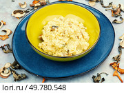 Vegetarian lunch, bowl of millet porridge with wild mushrooms.. Mushroom porridge for breakfast. Стоковое фото, агентство Ingram Publishing / Фотобанк Лори