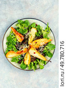 Chicken salad of caramelized pear, chicken liver and fresh lettuce.. Salad with liver, caramelized pear in a plate. Стоковое фото, агентство Ingram Publishing / Фотобанк Лори
