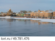 Embankment of Lieutenant Schmidt and the Church of the Assumption of the Blessed Virgin Mary (Assumption Church) on the banks of the Neva River on a winter day, Saint Petersburg, Russia. Стоковое фото, фотограф Ula Ulachka / Фотобанк Лори