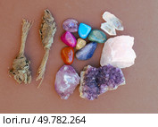 Healing crystals on brown background, top view. Healing crystals on brown background. Стоковое фото, агентство Ingram Publishing / Фотобанк Лори