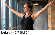 A curvy woman practicing Pilates at a fitness studio, feeling energized and empowered. Стоковое AI-изображение, AI-художник ALLA YURTAYEVA / Фотобанк Лори