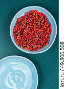 Superfood. Vegetarian, vegan. Portion of Goji Berries or Wolfberry. Overhead view.. Pile of Dried goji berries. Стоковое фото, агентство Ingram Publishing / Фотобанк Лори