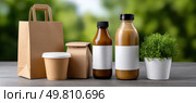 Eco friendly packaging showing sustainable food delivery on natural background. Стоковое AI-изображение, AI-художник Юрий Поздников / Фотобанк Лори